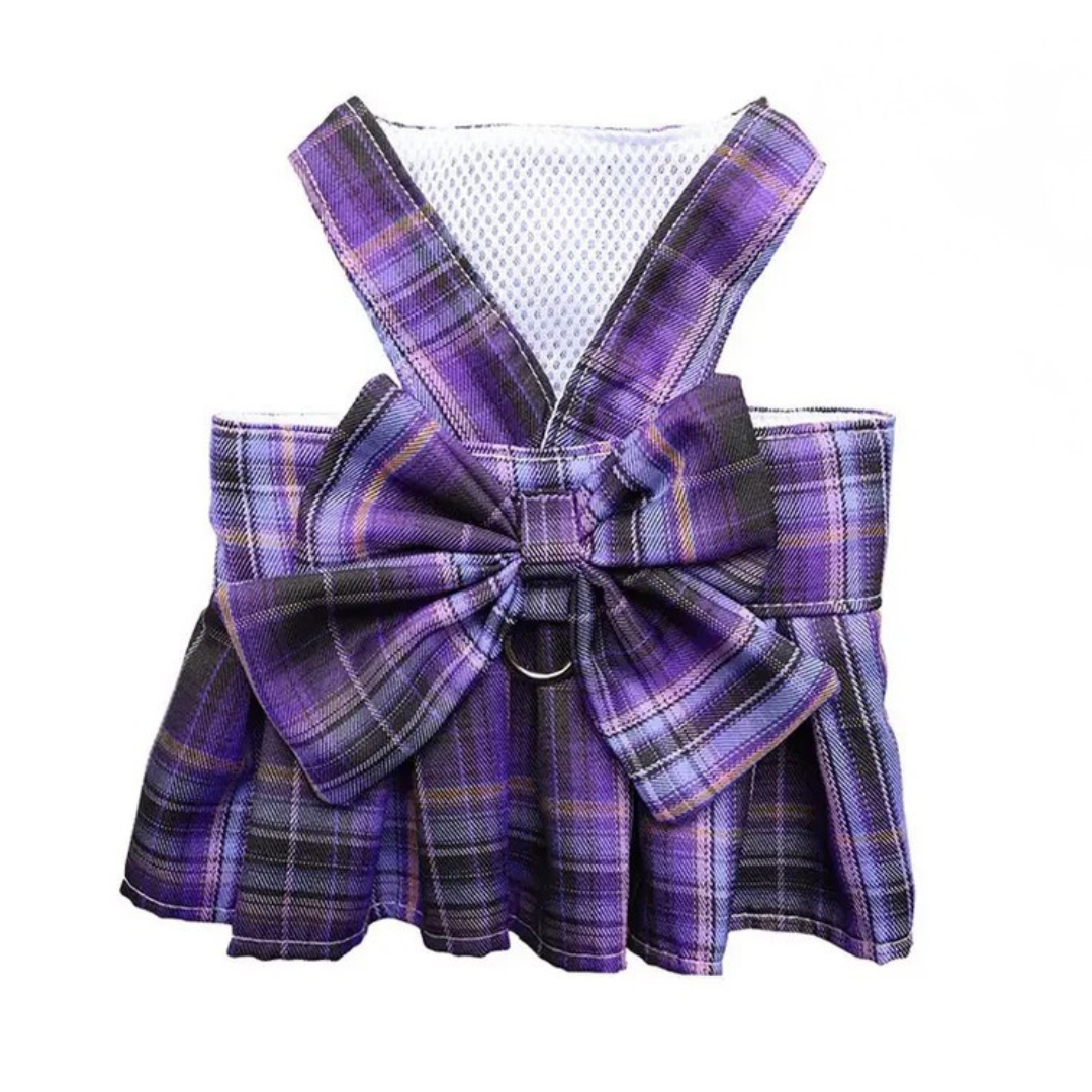 Purple plaid pet dress with a bow on a white background
