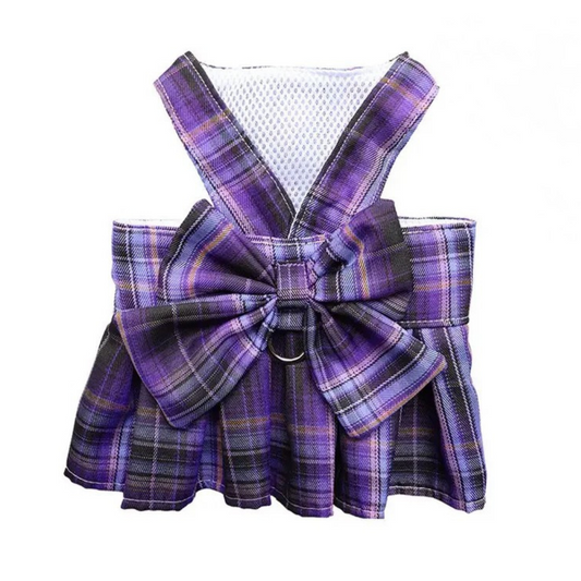 Purple plaid pet dress with a bow on a white background